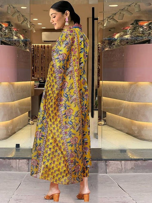 Woman wearing a yellow floral dress in a store setting